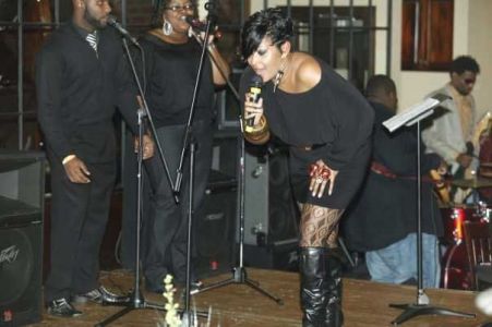 A close up image of Keeshea Pratt performing on stage